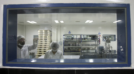 Pharmacists at a Natco manufacturing facility